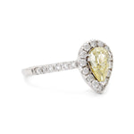 0.60 Carat Natural Light Fancy Yellow Pear-Shaped Diamond Halo Ring