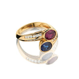 18KT Yellow Gold Ruby And Sapphire Cross-Over Ring